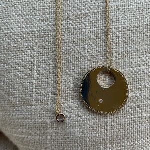 38” gold chain with gold disc diamond pendant